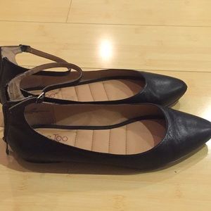 Black leather flats
